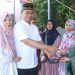 Kapolres Wajo bersama Ketua Bhayangkari Bagikan Masyarakat Daging Kurban 