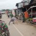 Personel Polres Torut Bersihkan Pasar Hewan Bolu Sambut HUT ke-69 Kodam XIV/Hasanuddin